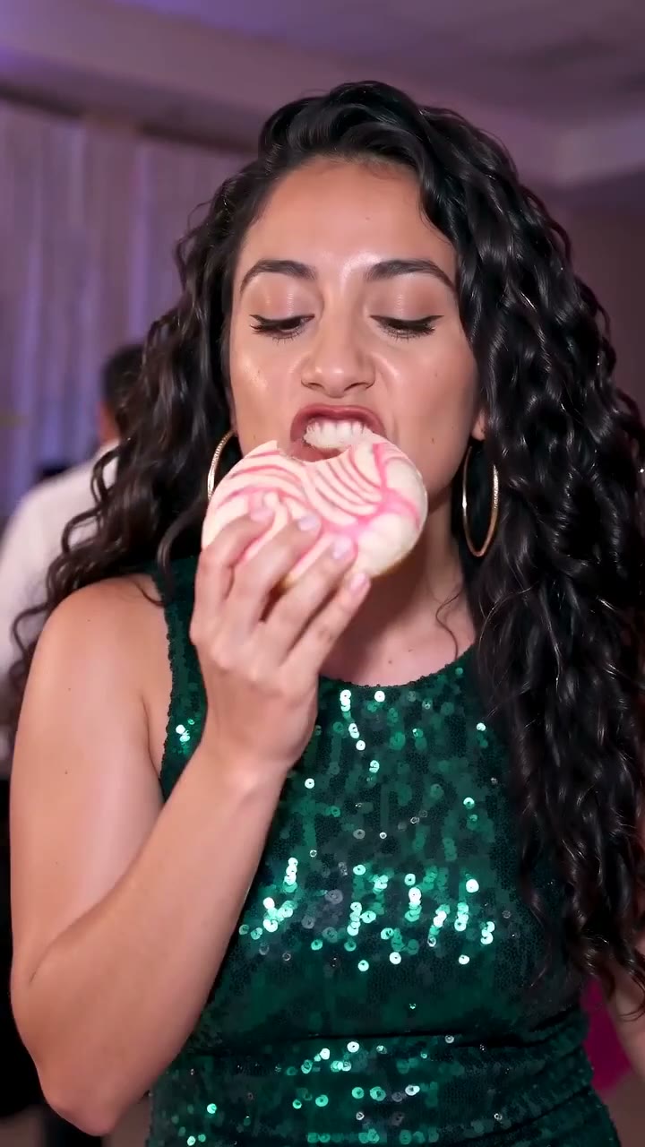 A Dime Dime Baby AI video: a woman biting a concha at a quinceañera party